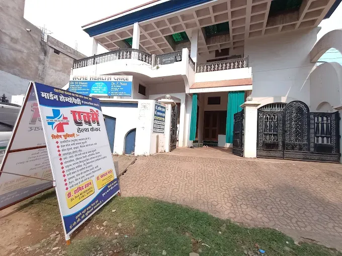 Photograph of ACME Health Care Clinic exterior building and entrance signboards at Doctors Colony, Shahdol